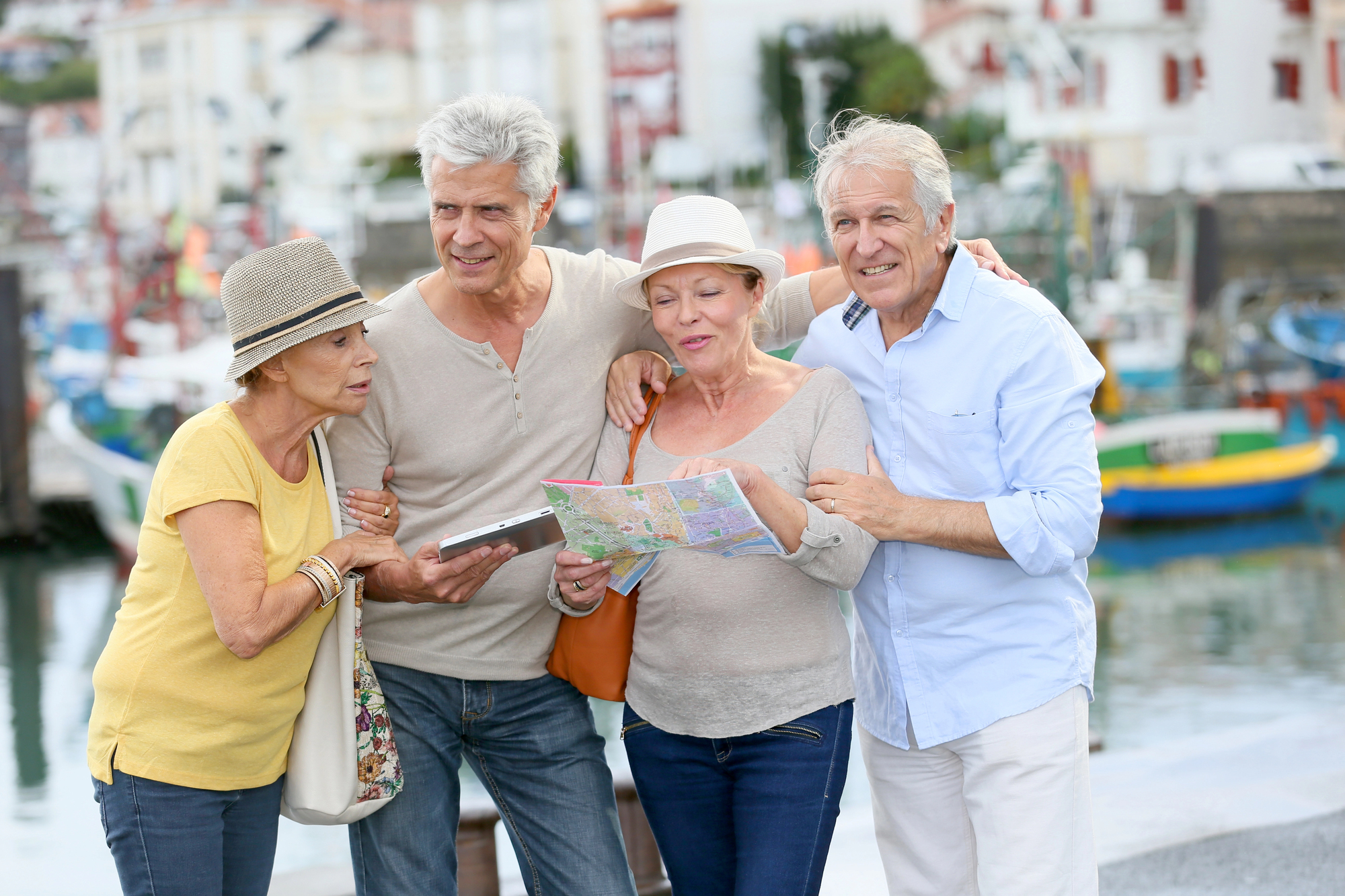 Is Group Travel Right for You? A Thoughtful Look at Hosted Group Travel for Adults - A Group of People Looking at a Map